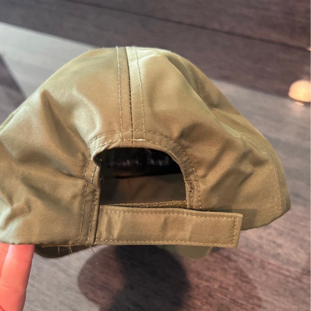 Army green “bad hair day” hat. In great condition